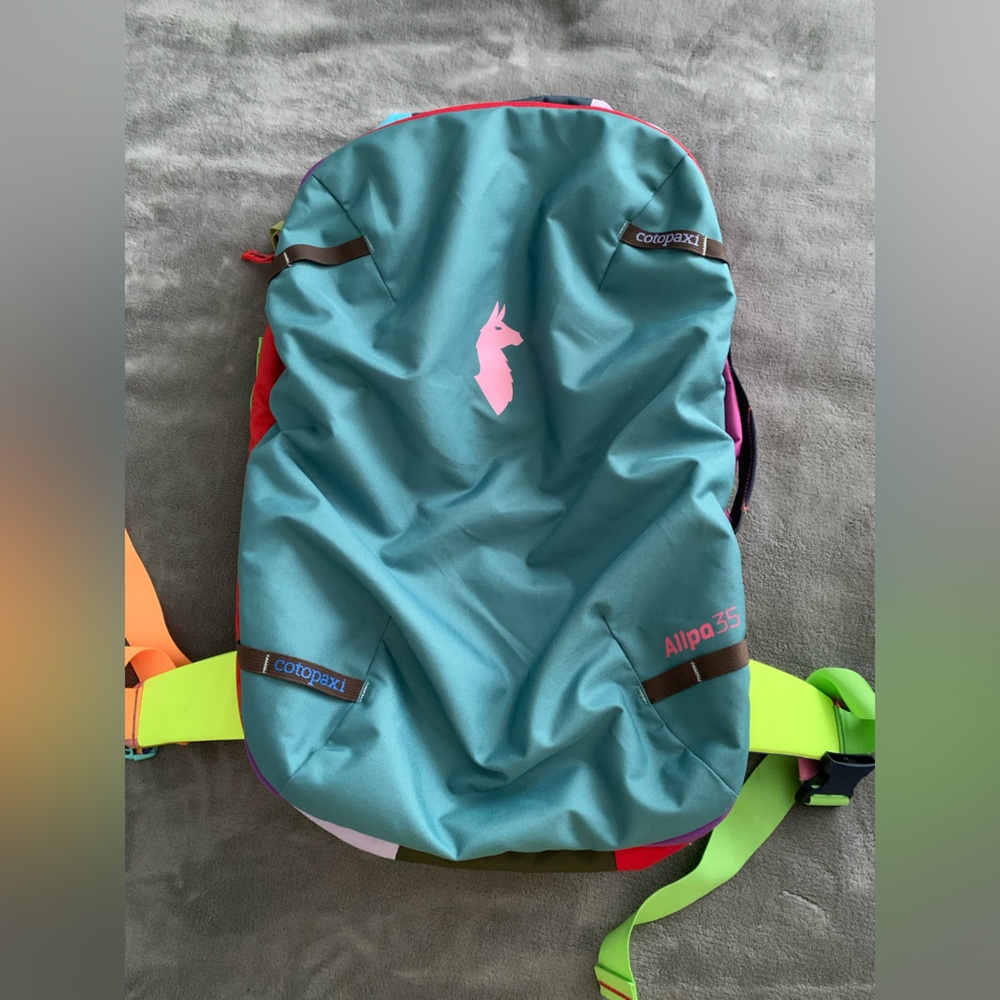 cotopaxi Teal Backpack with Pink Logo and Neon Green Straps